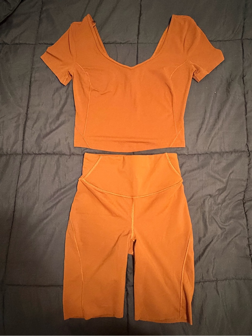 Lululemon matching set: Burnt Orange/Rust Crop Top (6) + Bike Shorts (4)